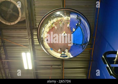 Camera mounted on factory ceiling to monitor workers and processes at Ocean Spray cranberry processing plant, Wisconsin Rapids, Wisconsin, USA Stock Photo