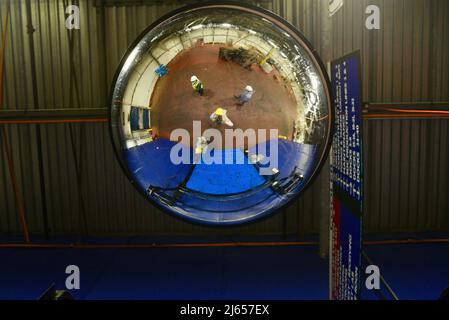 Camera mounted on factory ceiling to monitor workers and processes at Ocean Spray cranberry processing plant, Wisconsin Rapids, Wisconsin, USA Stock Photo