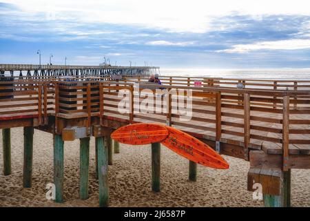 Pismo Beach, California, USA - March 3, 2022.  Pismo Beach pier, and wooden boardwalk in the heart of Pismo Beach city, California Stock Photo