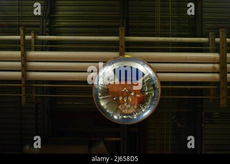 Camera mounted on factory ceiling to monitor workers and processes at Ocean Spray cranberry processing plant, Wisconsin Rapids, Wisconsin, USA Stock Photo