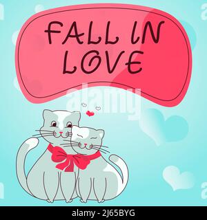 Sign displaying FALL IN LOVE. Business concept Charmed or captivated with someone Valentines Day Cats tied together with bow represent passionate Stock Photo