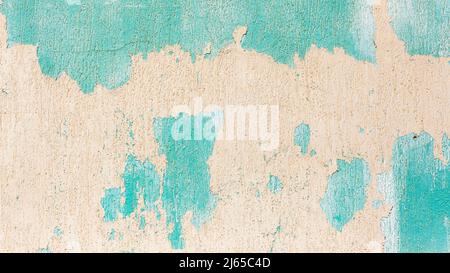 Wall paints peeling colors of cream white, turquoise, weather worn elements for texture abstract background. Stock Photo