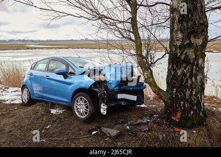 January 25, 2022, Riga, Latvia: car collision with tree at the scene of an accident on a road Stock Photo