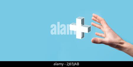Hand hold 3D plus icon, man hold in hand offer positive thing such as profit, benefits, development, CSR represented by plus sign.The hand shows the p Stock Photo
