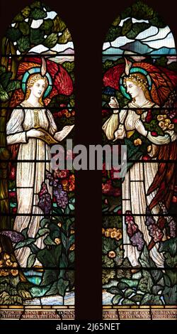 Winged angels in a flower garden by William Aikman (1899), All Saints Church, Watermillock, Cumbria, UK Stock Photo