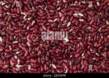background of many grains of dried beans top view, red beans texture, food background close up Stock Photo