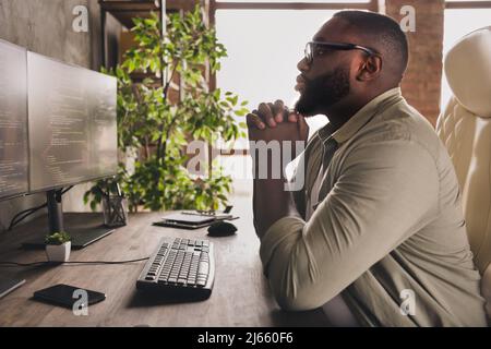 Profile side view portrait of attractive focused guy tech leader analyzing html css at workplace workstation indoors Stock Photo