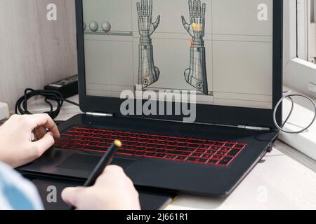 digital artist working on 3d graphics using a graphics tablet. Stock Photo