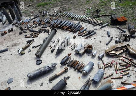 Ammunition is arranged on the premises of Antonov Airport, an international cargo airport that became the site of an intense battle during the 2022 Russian invasion of Ukraine, near Hostomel, Kyiv Region, northern Ukraine, April 27, 2022. After weeks of intense fight, Russian troops were ordered to abandon Hostomel Airport on March 31 and they are believed to head to Belarus for regrouping. Hostomel -also known as Antonov Airport- was deemed as key in the first hours of the invasion in late February, and the fight to control -and for Ukrainian forces, to recover- the airfield had a significant Stock Photo