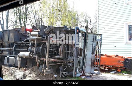 An overturned truck is pictured on the premises of Antonov Airport, an international cargo airport that became the site of an intense battle during the 2022 Russian invasion of Ukraine, near Hostomel, Kyiv Region, northern Ukraine, April 27, 2022. After weeks of intense fight, Russian troops were ordered to abandon Hostomel Airport on March 31 and they are believed to head to Belarus for regrouping. Hostomel -also known as Antonov Airport- was deemed as key in the first hours of the invasion in late February, and the fight to control -and for Ukrainian forces, to recover- the airfield had a si Stock Photo