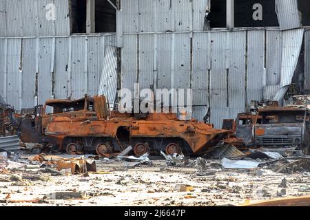Destroyed Russian military vehicles are pictured on the premises of Antonov Airport, an international cargo airport that became the site of an intense battle during the 2022 Russian invasion of Ukraine, near Hostomel, Kyiv Region, northern Ukraine, April 27, 2022. After weeks of intense fight, Russian troops were ordered to abandon Hostomel Airport on March 31 and they are believed to head to Belarus for regrouping. Hostomel -also known as Antonov Airport- was deemed as key in the first hours of the invasion in late February, and the fight to control -and for Ukrainian forces, to recover- the Stock Photo