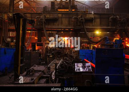 Process of Iron pipe casting at the foundry. Stock Photo