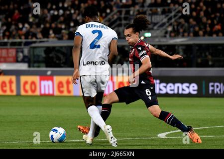 Denzel Dumfries of FC Internazionale and Arthur Theate of Bologna FC compete for the ball during the Serie A football match between Bologna FC and FC Stock Photo