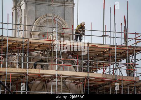 London UK,  28 April 2022.  The Victoria memorial monument in front of Buckingham Palace is covered in scaffold as part of restoration work in preparation for  Queen Elizabeth II platinum jubilee celebrations. In tribute to Her Majesty the Queen’s 70 years of service many events and initiatives will take place culminating in a four day UK bank holiday weekend from Thursday 2nd to Sunday 5th June.  Credit: amer ghazzal/Alamy Live News Stock Photo