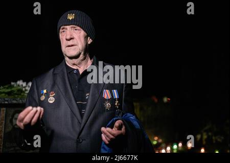 Slavutych, Ukraine. 26th Apr, 2022. A veteran working in the electricity department of Chernobyl Nuclear Power plant attended the ceremony. The 36th Anniversary of the disaster at Chernobyl nuclear power plant occurred on April 26th 1986 (at 01.23.40 am), was commemorated with a public ceremony in Slavutych (Ukraine), a satellite city built after the catastrophe, mainly hosting workers of the plant. (Photo by Valeria Ferraro/SOPA Images/Sipa USA) Credit: Sipa USA/Alamy Live News Stock Photo