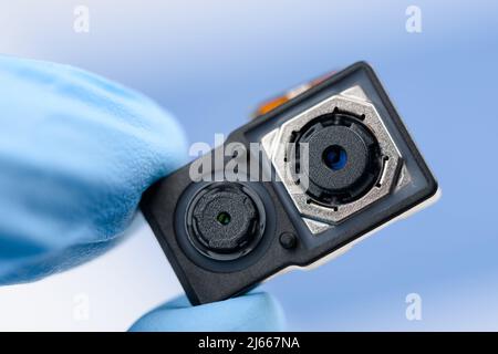 Smartphone dual camera sensor system module in scientist hand Stock Photo