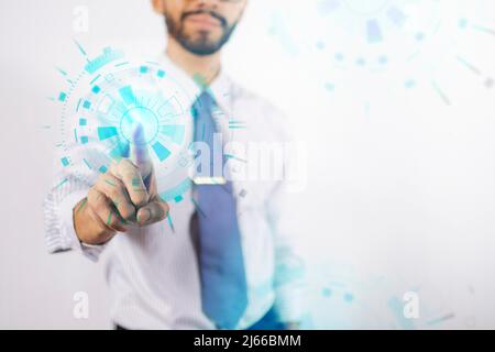 Businessman touching holographic icons, man selecting technology icons in the air, concept boy touching digital button Stock Photo