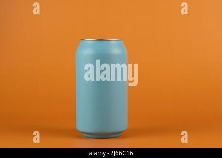 Blue aluminum can isolated on orange background Stock Photo