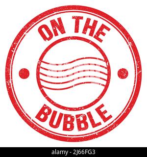 ON THE BUBBLE text written on red round postal stamp sign Stock Photo