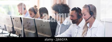 Portrait Of A Happy Young Female Customer Service Executive Stock Photo