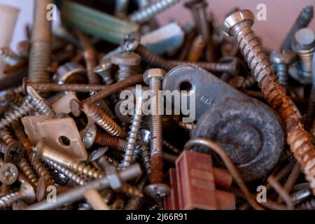 Pile of rusty nails and hardware stuff, hardware concept, selective focus, close-up rusty nails background, nuts and bolts Stock Photo