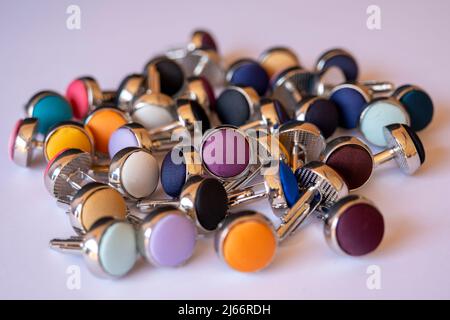 Cufflinks isolated on white background, front view, colorful cufflink background, man fashion concept Stock Photo