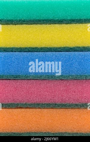 Multi-colored sponges for household work from foam rubber, stack, on a white background. Stock Photo