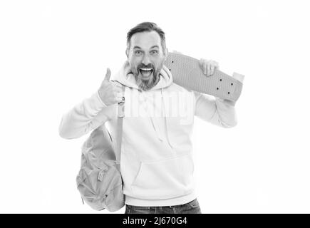 smiling senior guy back to school isolated on white. man in yellow hoody with skateboard. Stock Photo