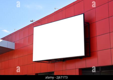 Led display advertising mockup. Isolated screen surface in white for ad design promotion on red shooping mall Stock Photo