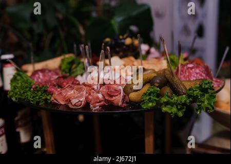 Slicing different varieties of meat. Wedding buffet Stock Photo