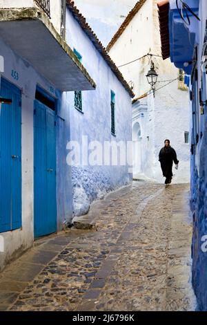 Woman in traditional jabala Chefchaouen Morocco Stock Photo