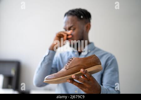 Smelly Shoes. Stinky Feet Sweat. Foot Odor Stock Photo