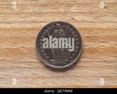 Half franc coin currency of Switzerland over wooden background Stock Photo