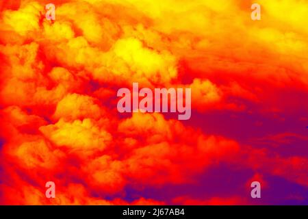 Colored clouds. Cloudscape under the wing of an airplane. Illustration of thermal image Stock Photo