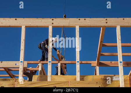 Carpenters work on prefabricated house construction in Ontakesan, Tokyo, Japan Stock Photo