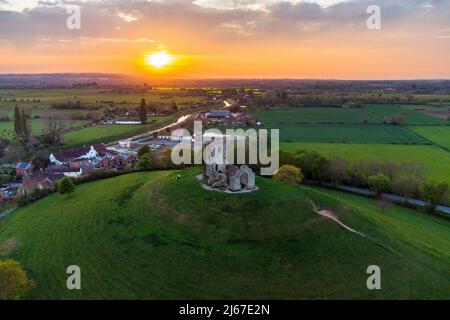 Burrowbridge, Somerset, UK.  28th April 2022.  UK Weather.  View from the air at sunset of the ruined church on top of Burrow Mump at Burrowbridge in Somerset.  Picture Credit: Graham Hunt/Alamy Live News Stock Photo
