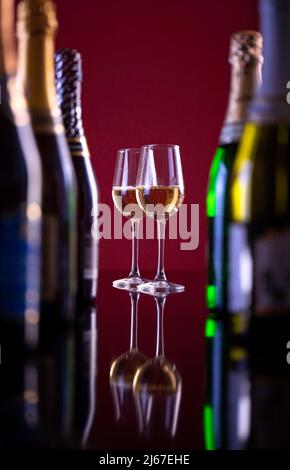 Two glasses of sparkling wine for coffee bottles.beautiful photo of alcohol. Stock Photo