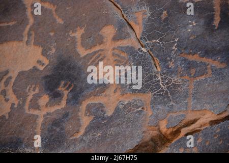 Ancient rock art from Saudi Arabia showing human and animals Stock Photo