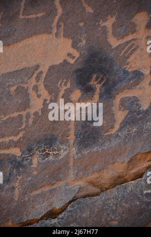 Ancient rock art from Saudi Arabia showing human and animals Stock Photo