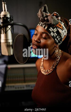 Young Africanamerican Female Singer Recording Song In The Music Studio  Stock Photo - Download Image Now - iStock