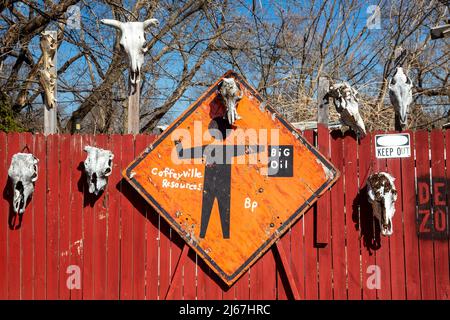 Coffeyville, Kansas - Animal skulls and signs remain as a protest in the 'dead zone' after a 2007 oil spill at the Coffeyville Resources oil refinery. Stock Photo