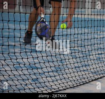 sportsman playing paddle tennis on an outdoor court Stock Photo