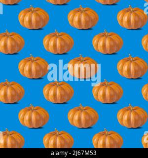 Seamless pattern with pumpkin on blue background for wallpaper, fabric or wrapping-paper. Vegetable concept Stock Photo