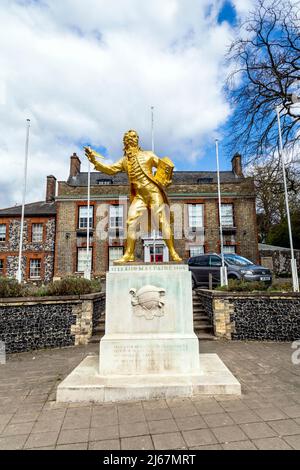 Golden statue of writer and philosopher Thomas Paine by Charles Wheeler outside King's House in Thetford, Norfolk, UK Stock Photo