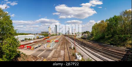 View along railway lines to the new skyscraper tower blocks of the mixed use Victoria Square development in the town centre of Woking, Surrey Stock Photo