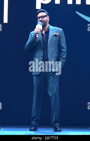 Mumbai, India. 28th Apr, 2022. Bollywood actor Ajay Devgn speaks during the Amazon Prime Video launch in Mumbai. The American video streaming company launched the event to announce its investment plans for the content in India for the next two years. It includes movies and shows in different Indian languages. Credit: SOPA Images Limited/Alamy Live News Stock Photo