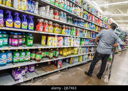 North Miami Beach Florida Walmart discount department store inside interior shopping display sale shelf shelves man looking Lysol all-purpose cleaner Stock Photo
