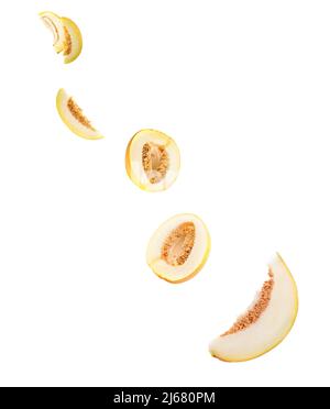 Flying cut melon isolated on white Stock Photo