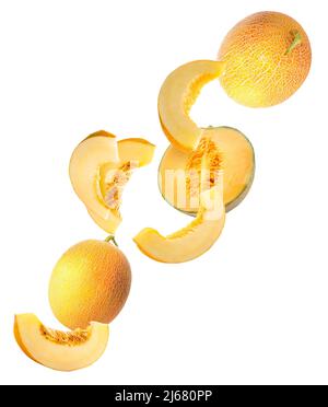 Flying ripe melons and slices isolated on white Stock Photo