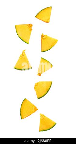 Falling slices of ripe melon isolated on white Stock Photo